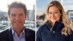 business man and woman smilling