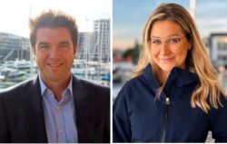 business man and business woman smiling