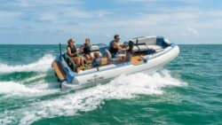 Family onboard electric jet tender on the water