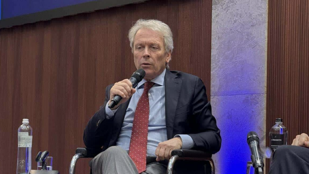 business man talking and sitting with microphone