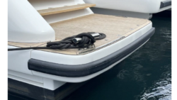 Black rub rail fender at the back of a boat's bathing platform