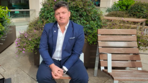 Wade Pearce sitting on a bench