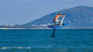 man launching into the air on an electric eFoiler