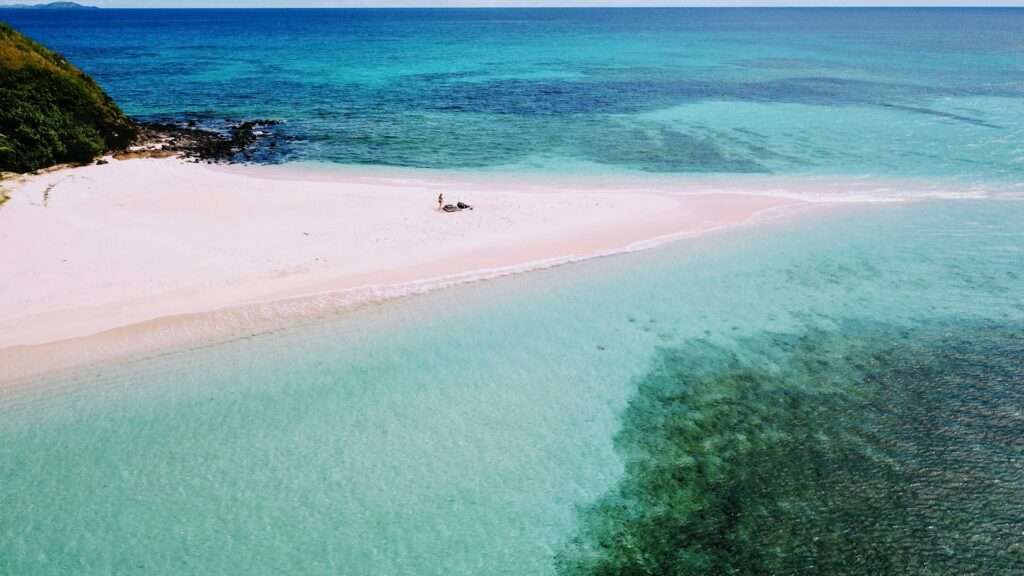 Blue seas and white sand beach in Fiji
