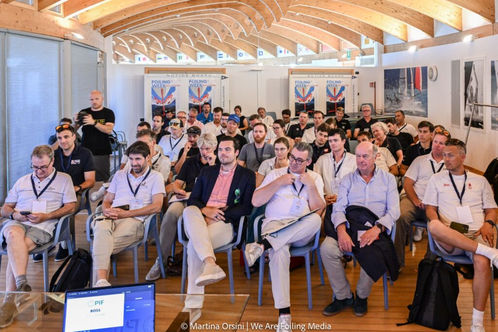 Bright conference room of men sitting in audience