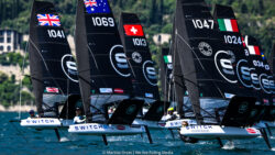 Black foiling boats during tight race