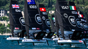 Black foiling boats during tight race