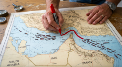 Map showing Strait of Hormuz with red lines and ships positioned on it