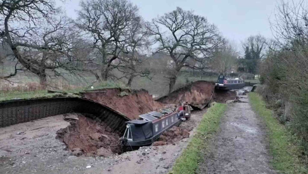 Narrowboat in a dry canal breach