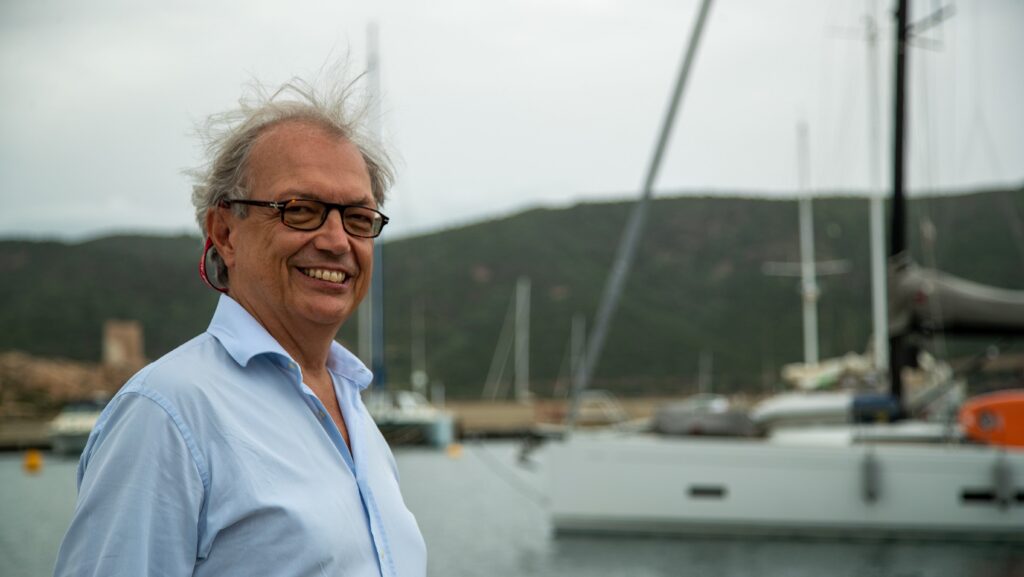 Headshot of Marinedi's CEO Renato Marconi standing in front of a boat