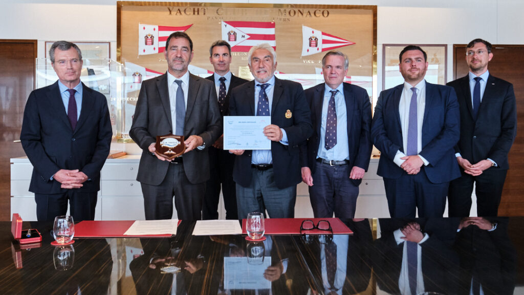 Men shaking hands and holding document