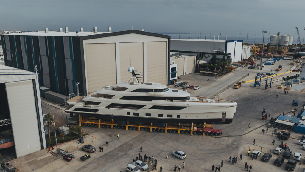 white superyacht coming out of shipyard