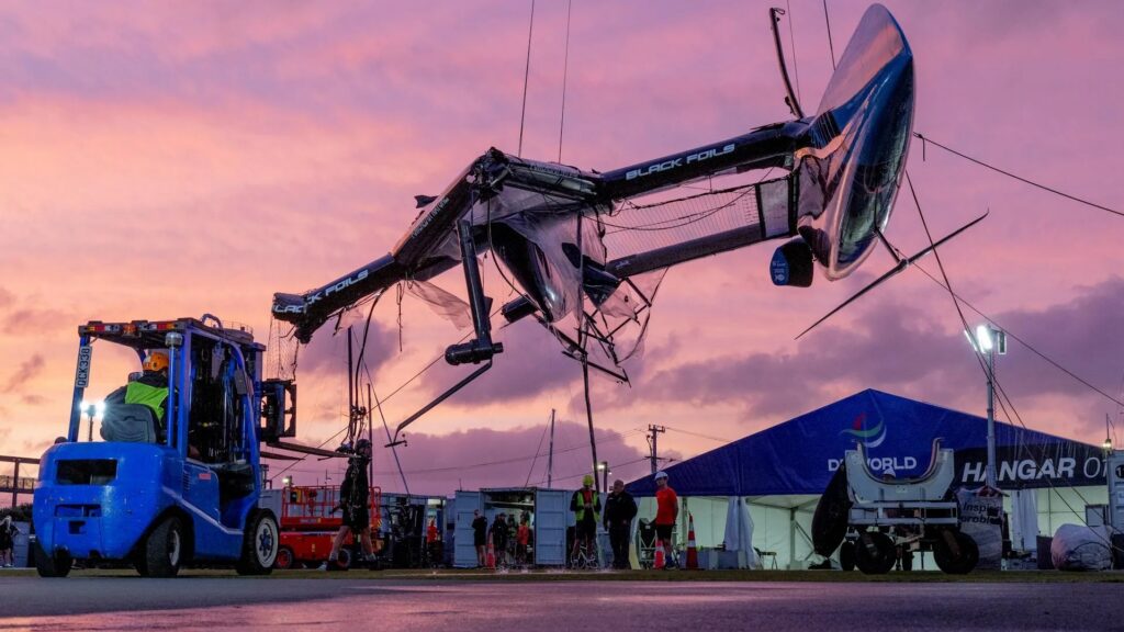 The damaged Black Foils SailGP Team F50 catamaran is craned out of the water on Race Day 1 of the ITM New Zealand Sail Grand Prix in Auckland, New Zealand