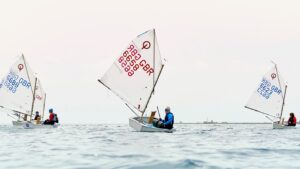Three dinghies sailing at sea