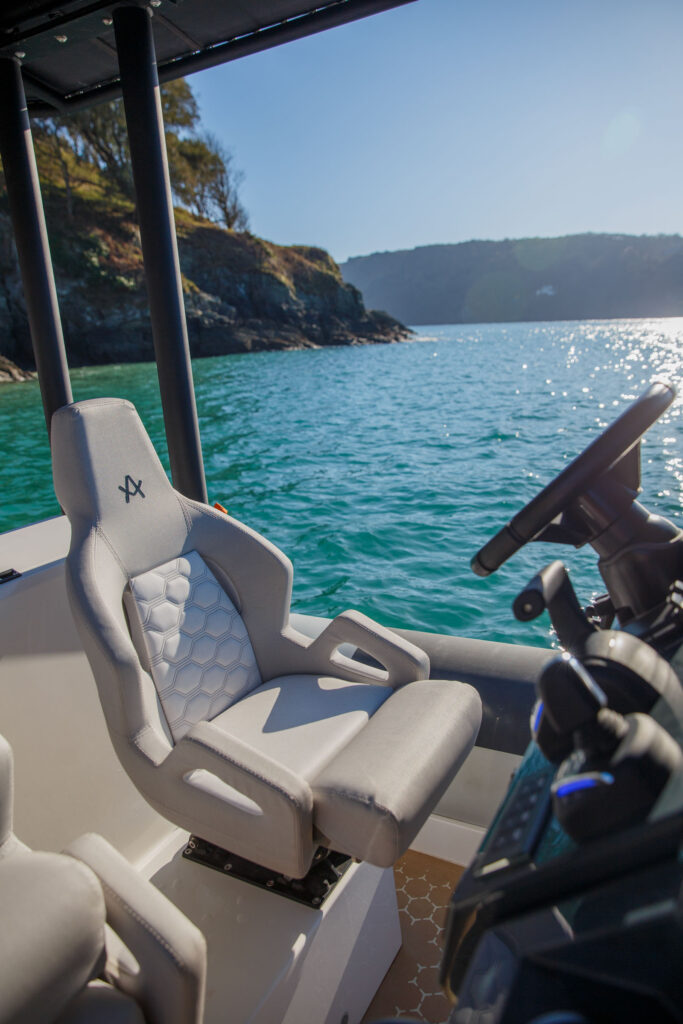 Arksen boat helm seat with boat on the water