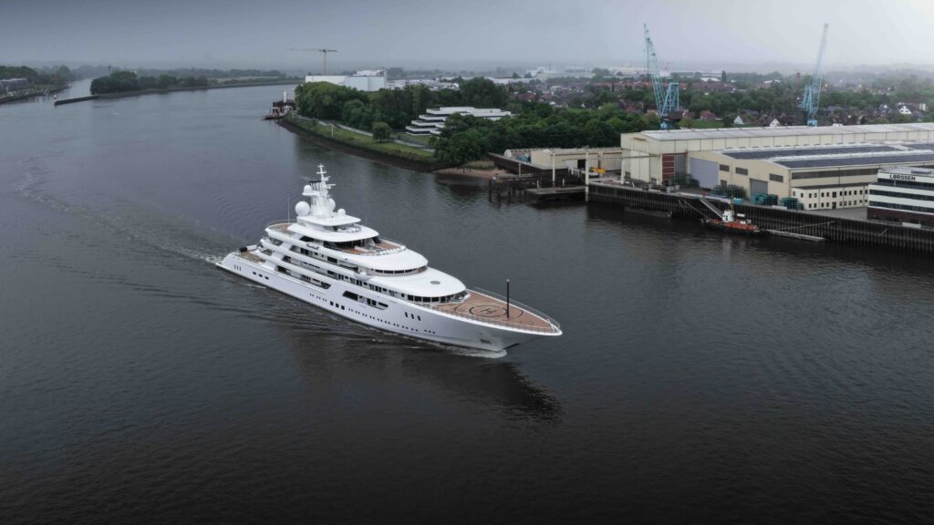 White large superyacht with grey skies