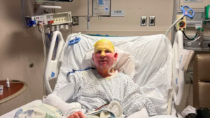 Connor Gecewicz in his hospital bed after fishing boat explosion
