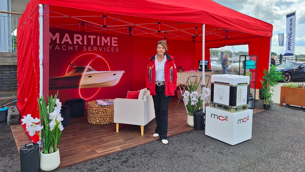 Fiona Pascoe from Maritime Yacht Services stands outside a red booth