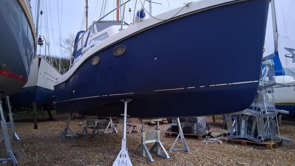 Nautipark system in use under blue yacht on hard standing