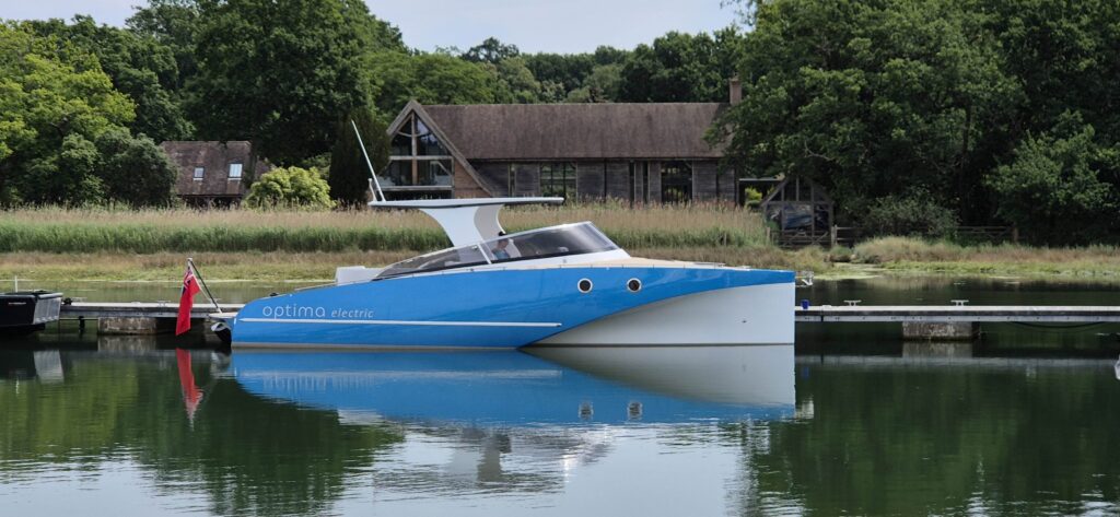Small electric boat with light blue hull