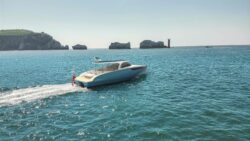 White motor boat by The Needles, Isle of Wight