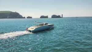 White motor boat by The Needles, Isle of Wight