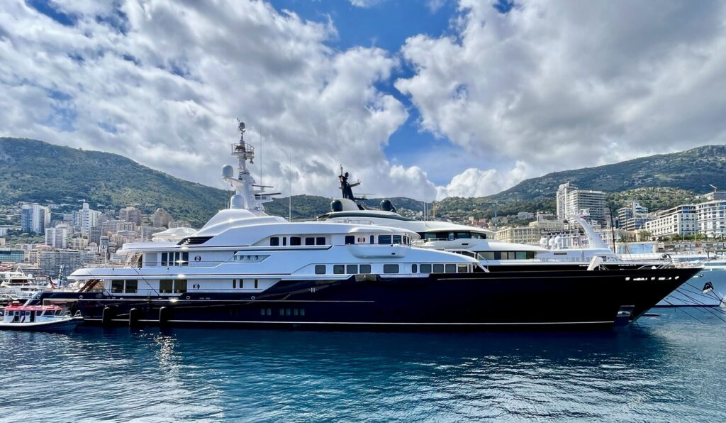 large navy hulled superyacht side on