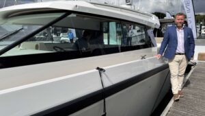 Simon Rosier SE Yachts Director next to Delta Coupé boat