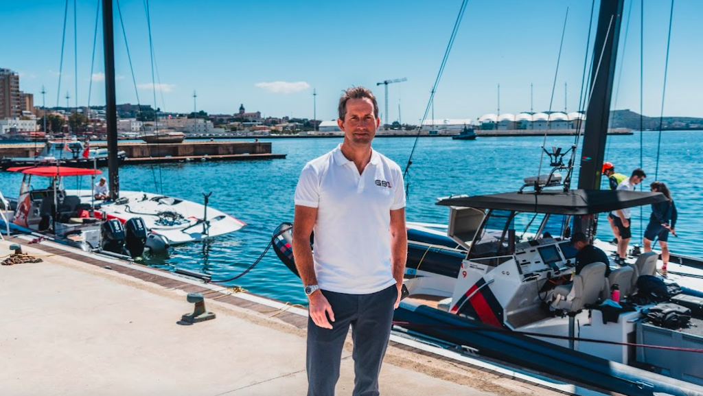 Ben Ainslie standing on a dock