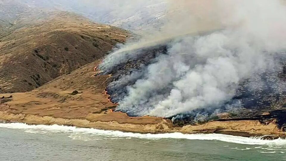 Smoke rises across Santa Rosa Island