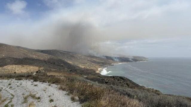 Smoke rises across Santa Rosa Island