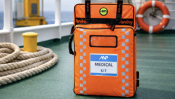Orange medical emergency bag on deck of ship