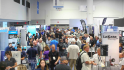 people throng an exhibition hall