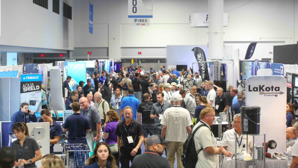 people throng an exhibition hall