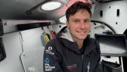 Lincoln Dews headshot onboard Oliver Heer's IMOCA