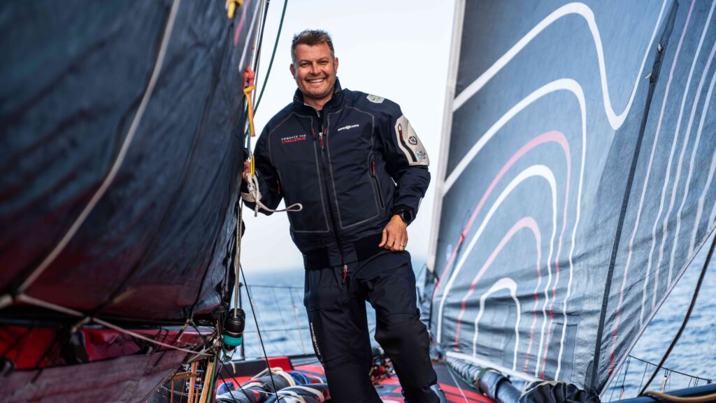Oliver Heer between sails on his IMOCA