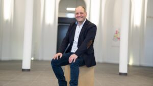 Reintjes Group managing director Klaus Deleroi sits on a box in a room