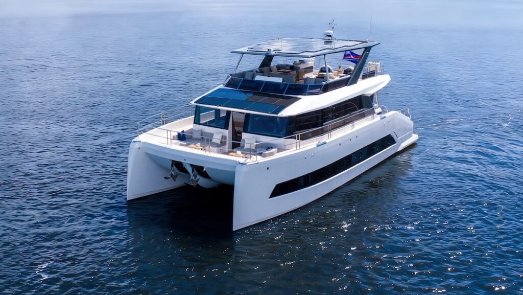 white catamaran at sea