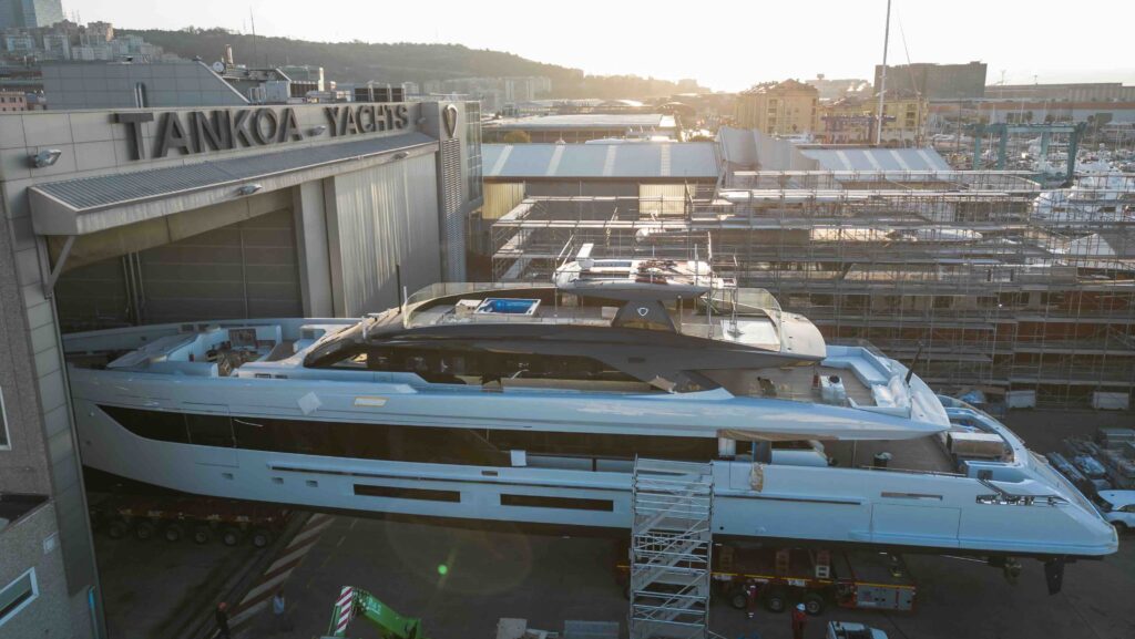 superyacht entering massive shipyard shed