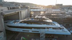 superyacht entering massive shipyard shed