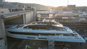 superyacht entering massive shipyard shed