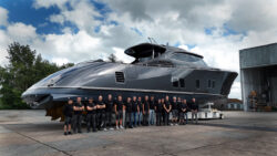 Zeelander Yacht's team stand beside latest vessel on boatbuilders' hard standing