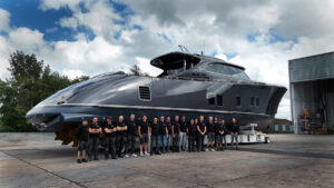 Zeelander Yacht's team stand beside latest vessel on boatbuilders' hard standing