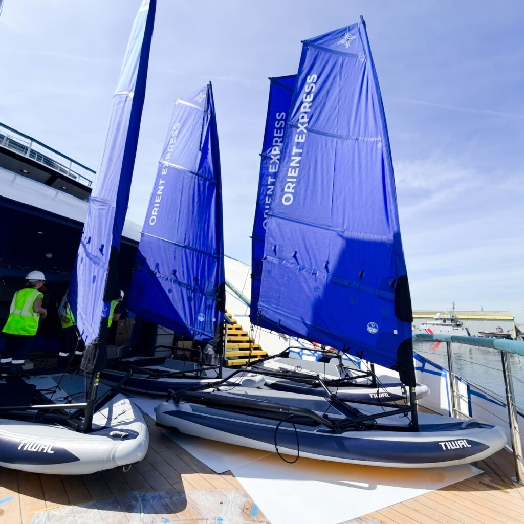 Tiwal inflatbale dinghies with blue sails saying Orient Express on them