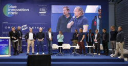 group of people on stage at conference