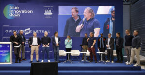group of people on stage at conference