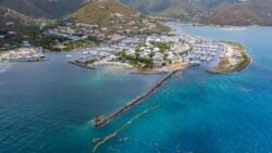 Aerial view of Caribbean marina and mountain backdrop