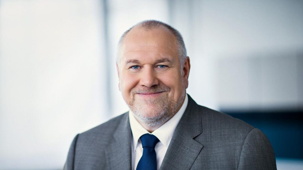 Man in suit smiling