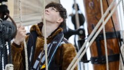 Young man on sailboat