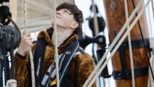 Young man on sailboat